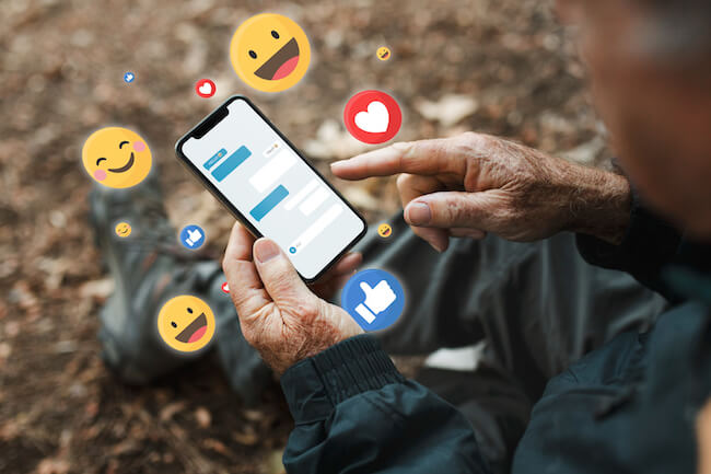 senior-man-receiving-positive-reactions-from-social-media